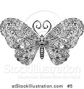 Vector Illustration of an Elegant Butterfly with Swirls on Its Wings by AtStockIllustration