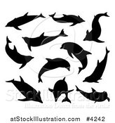 Vector Illustration of Black Silhouetted Dolphins by AtStockIllustration