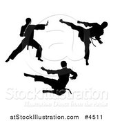 Vector Illustration of Black Silhouetted Karate and Martial Arts Men by AtStockIllustration