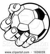Vector Illustration of Cartoon Hand Holding Soccer Ball by AtStockIllustration