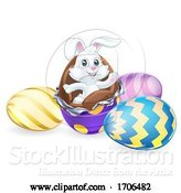 Vector Illustration of Easter Bunny Rabbit Breaking Chocolate Egg by AtStockIllustration