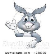 Vector Illustration of Easter Bunny Rabbit Character Peeking Sign by AtStockIllustration