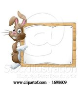 Vector Illustration of Easter Bunny Rabbit Peeking Around Sign Pointing by AtStockIllustration