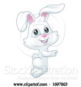 Vector Illustration of Easter Bunny Rabbit Peeking Pointing Sign by AtStockIllustration