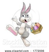 Vector Illustration of Easter Bunny Rabbit with Eggs Basket by AtStockIllustration