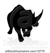 Vector Illustration of Silhouetted Charging Rhino with a Shadow on a White Background by AtStockIllustration
