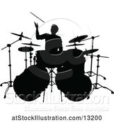 Vector Illustration of Silhouetted Male Drummer by AtStockIllustration