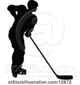 Vector Illustration of Silhouetted Male Ice Hockey Player by AtStockIllustration