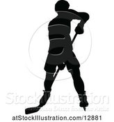 Vector Illustration of Silhouetted Male Ice Hockey Player by AtStockIllustration