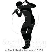 Vector Illustration of Silhouetted Male Singer by AtStockIllustration