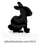 Vector Illustration of Silhouetted Rabbit, with a Reflection or Shadow, on a White Background by AtStockIllustration