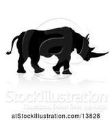 Vector Illustration of Silhouetted Rhino Walking, with a Reflection or Shadow by AtStockIllustration