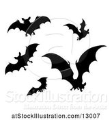 Vector Illustration of Silhouetted Vampire Bats by AtStockIllustration