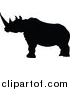 Vector Illustration of a Black Silhouetted Rhinoceros by AtStockIllustration