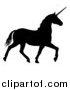 Vector Illustration of a Black Silhouetted Unicorn Horse Trotting by AtStockIllustration